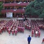 Student standing at the assembly ground