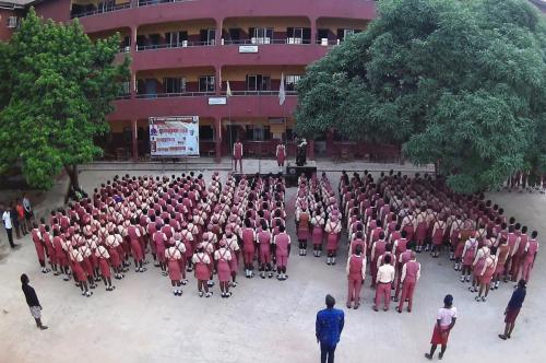 Student standing at the assembly ground