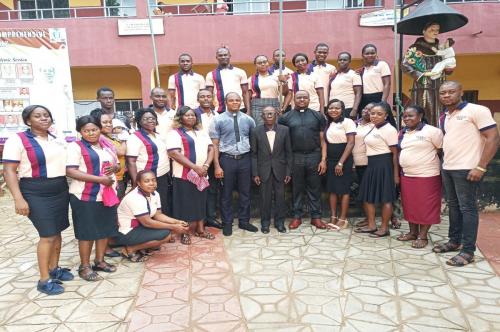 Members of staff poses for a group photograph